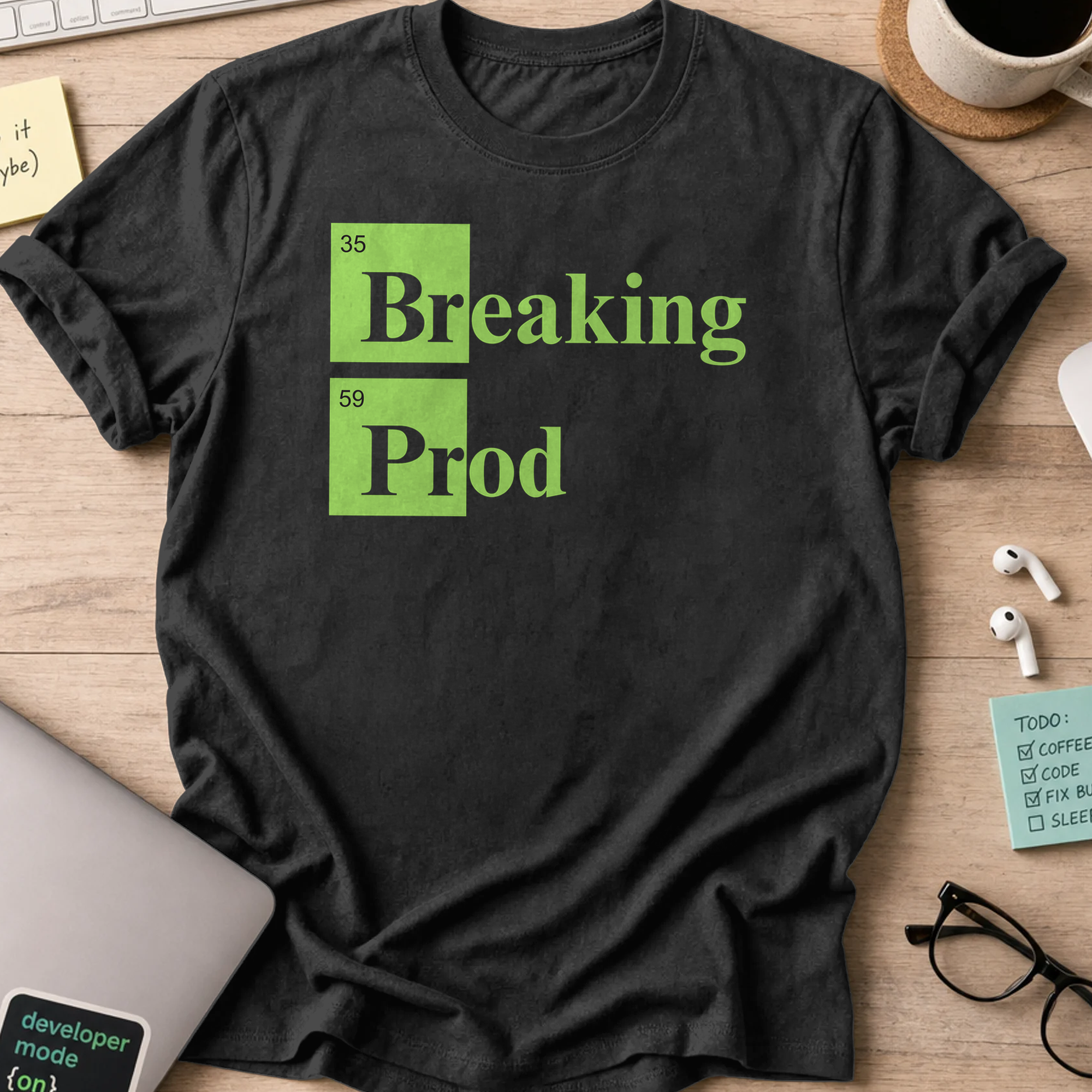 Black devops shirt printed with "Breaking Prod", a funny programmer t-shirt and coding gift for software engineers and DevOps teams.