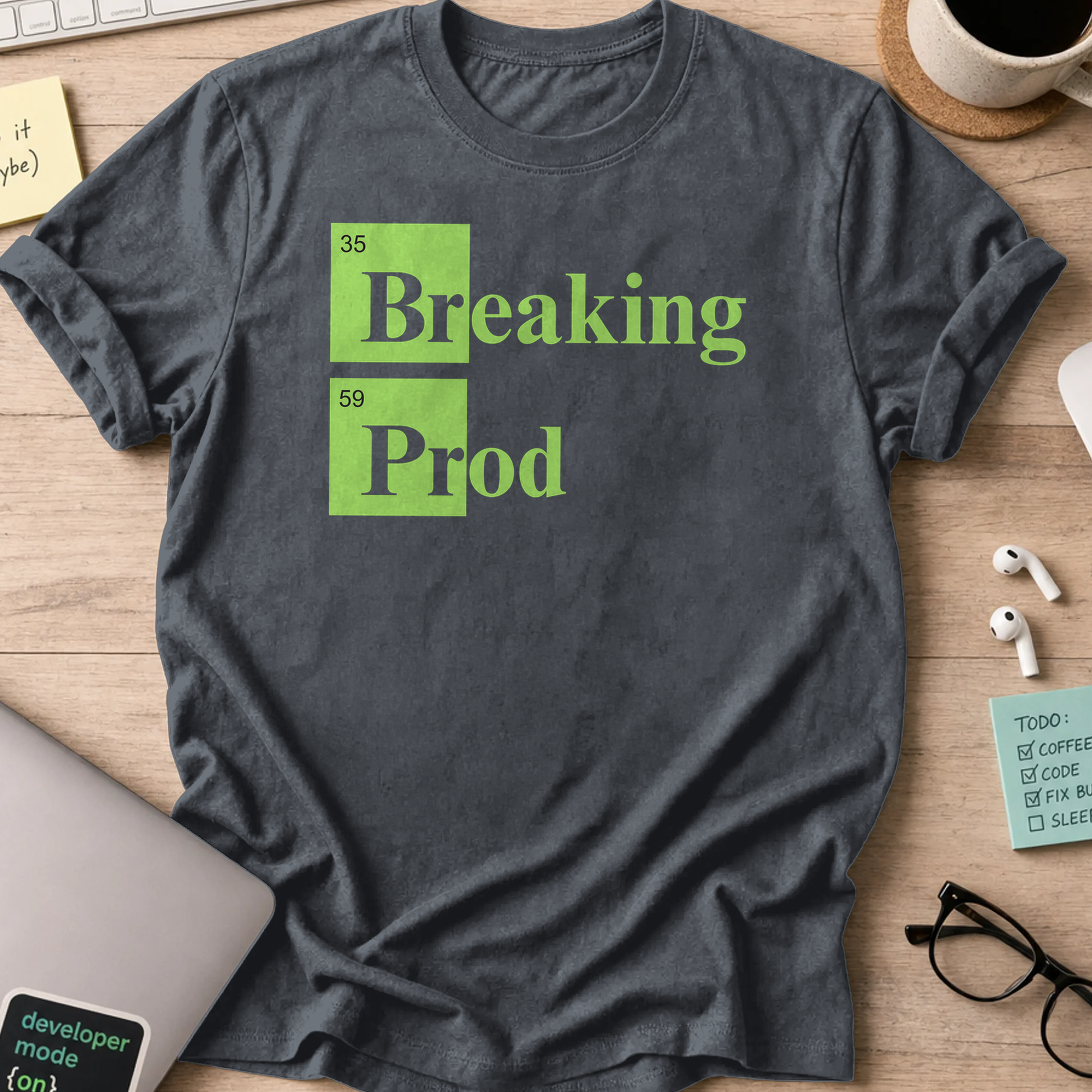 Dark Heather Grey devops shirt printed with "Breaking Prod", a funny programmer t-shirt and coding gift for software engineers and DevOps teams.