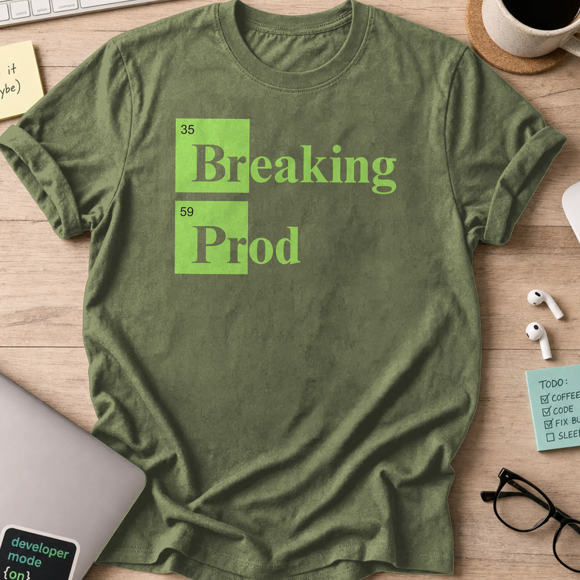 Military Green devops shirt printed with "Breaking Prod", a funny programmer t-shirt and coding gift for software engineers and DevOps teams.