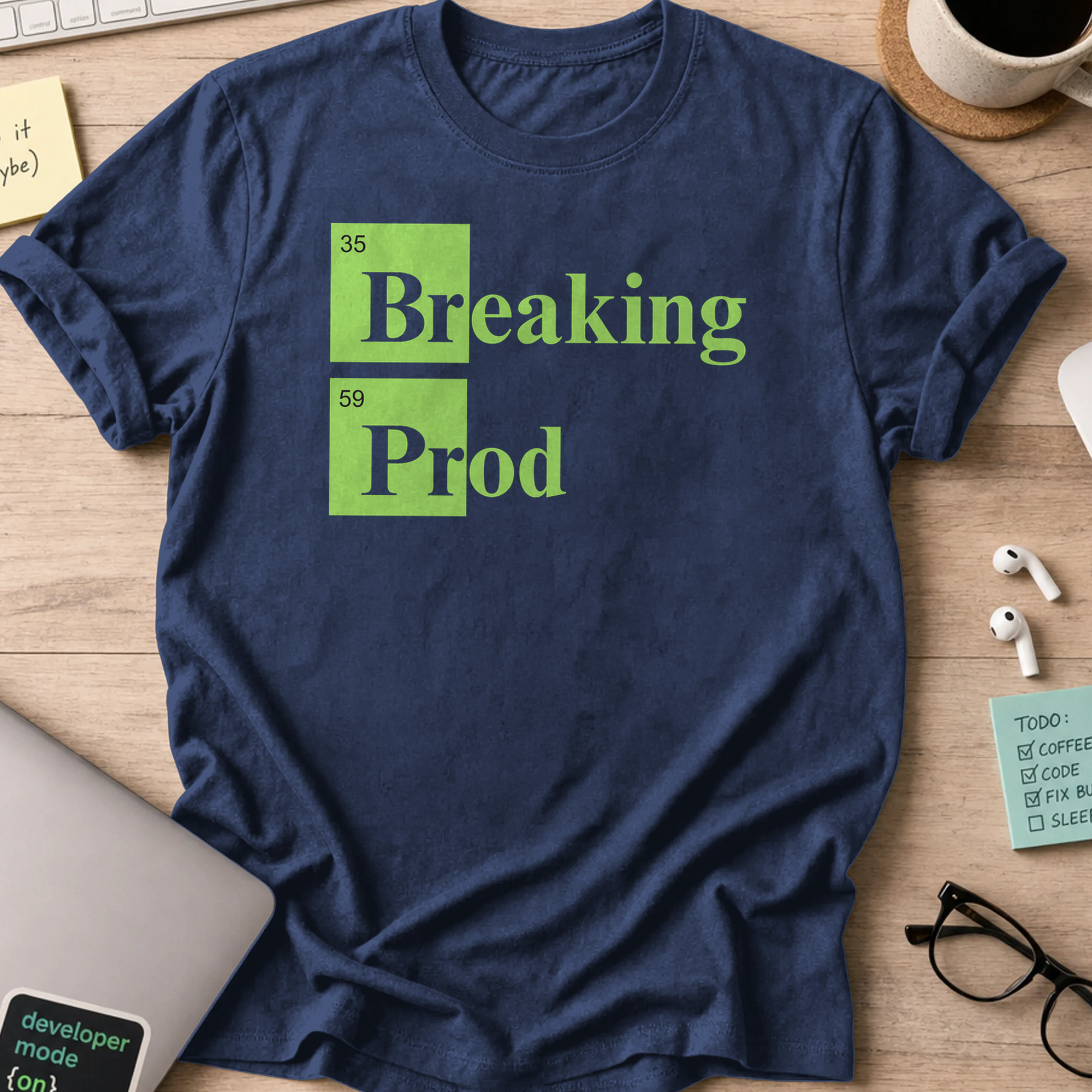 Navy devops shirt printed with "Breaking Prod", a funny programmer t-shirt and coding gift for software engineers and DevOps teams.