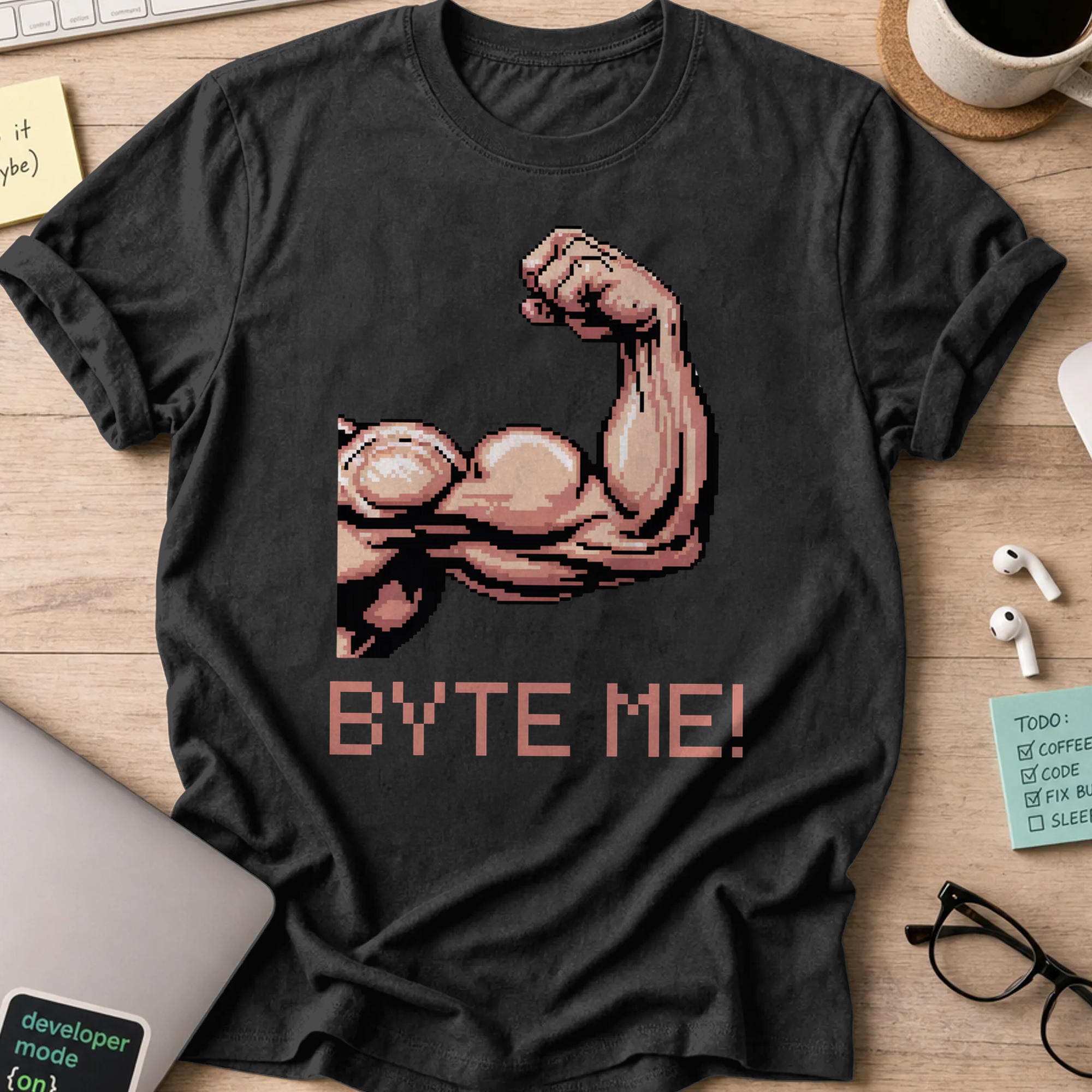 Black programmer shirt printed with "byte me macho", a funny developer t-shirt and coding gift for software engineers and coders.