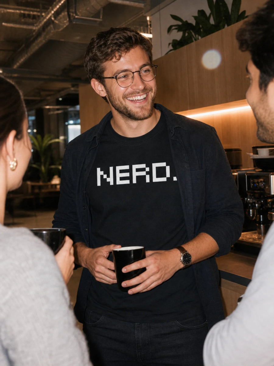 Developer in an office coffee corner wearing the black NERD. tee
