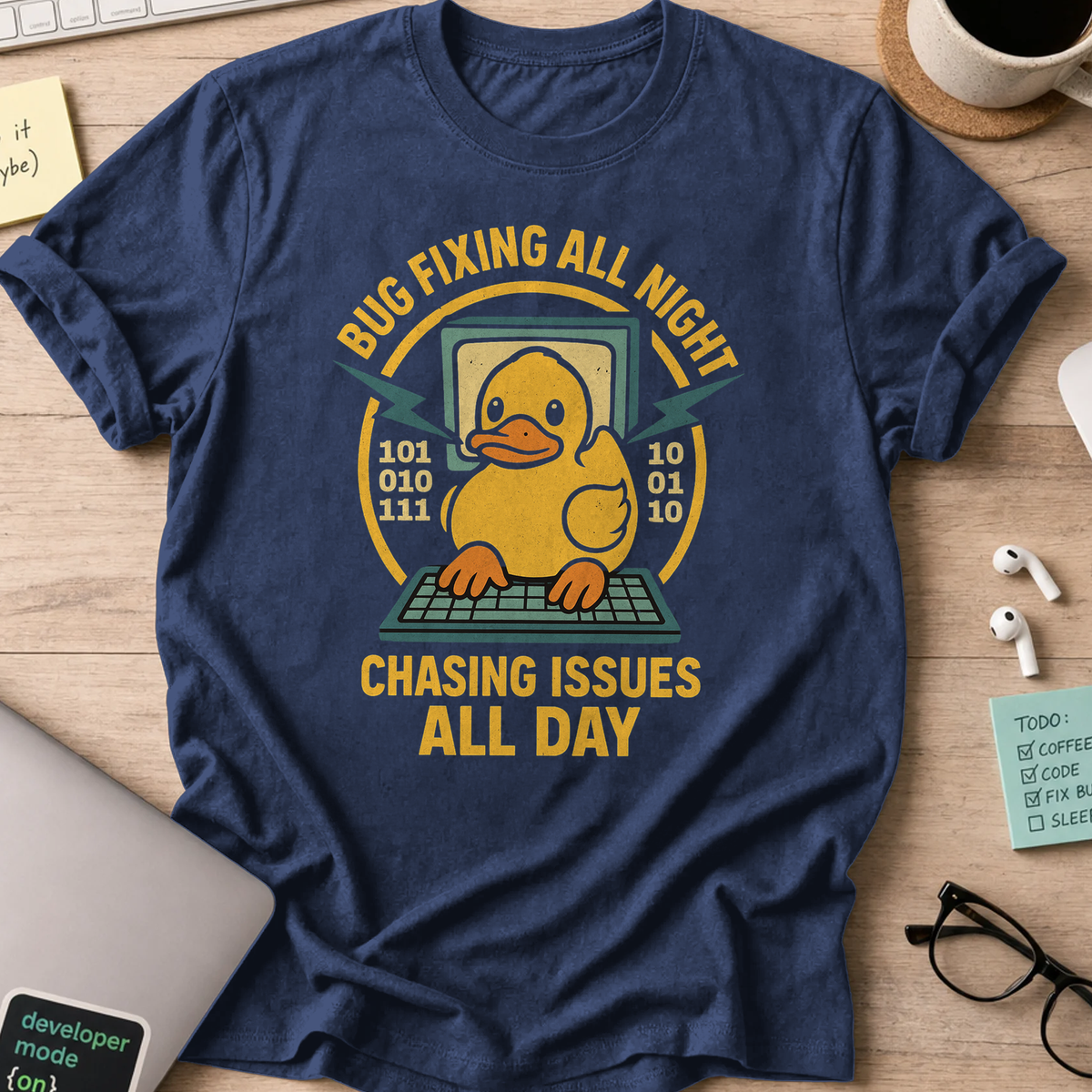 Navy programmer shirt printed with "chasing issues all day", a funny developer t-shirt and coding gift for software engineers and coders.