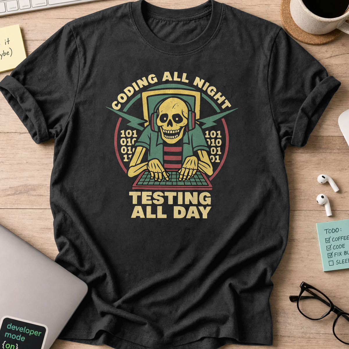Black programmer shirt printed with "coding all night testing all day", a funny developer t-shirt and coding gift for software engineers and coders.
