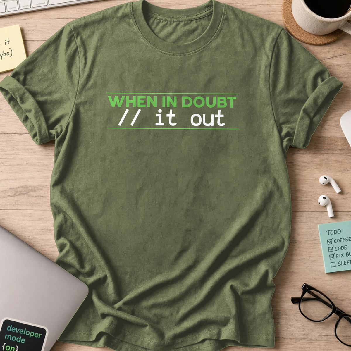 Military Green programmer shirt printed with "comment it out", a funny developer t-shirt and coding gift for software engineers and coders.