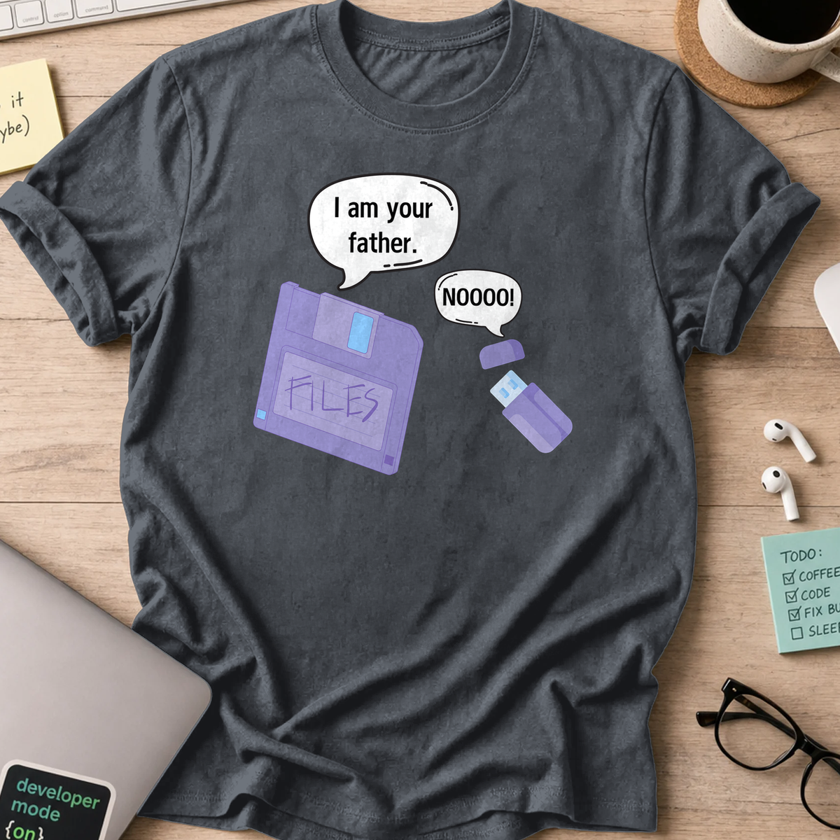 Dark Heather Grey programmer shirt printed with "daddy diskette and baby usb", a funny developer t-shirt and gift for the programmer dad in your life.