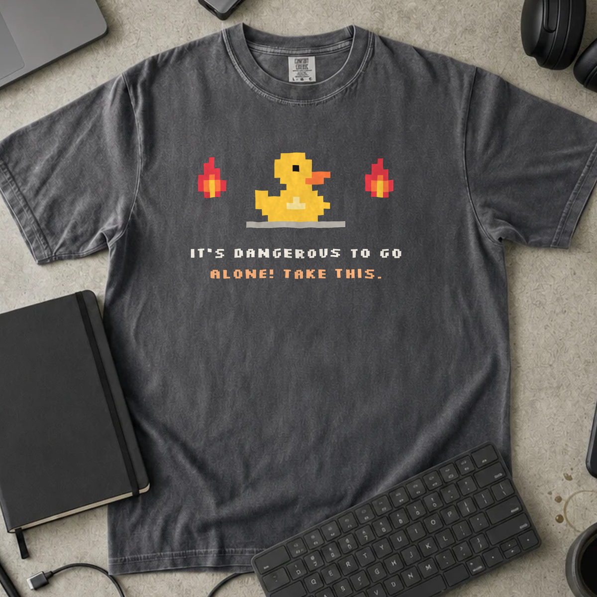 It's Dangerous to Go Alone! Take This. Shirt — Pepper Comfort Colors 1717 flat lay