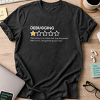Black programmer shirt printed with "debugging review", a funny developer t-shirt and coding gift for software engineers and coders.