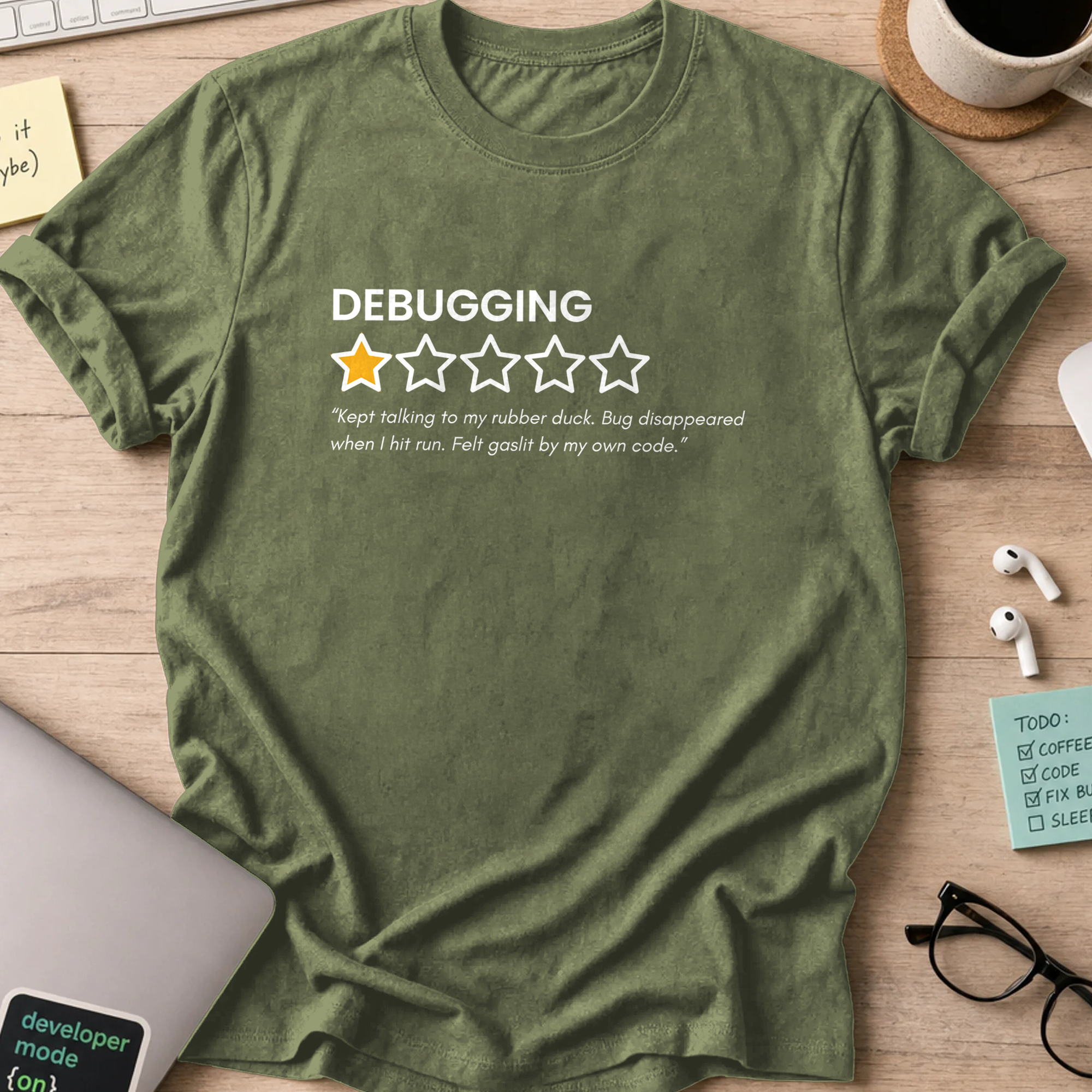 Military Green programmer shirt printed with "debugging review", a funny developer t-shirt and coding gift for software engineers and coders.