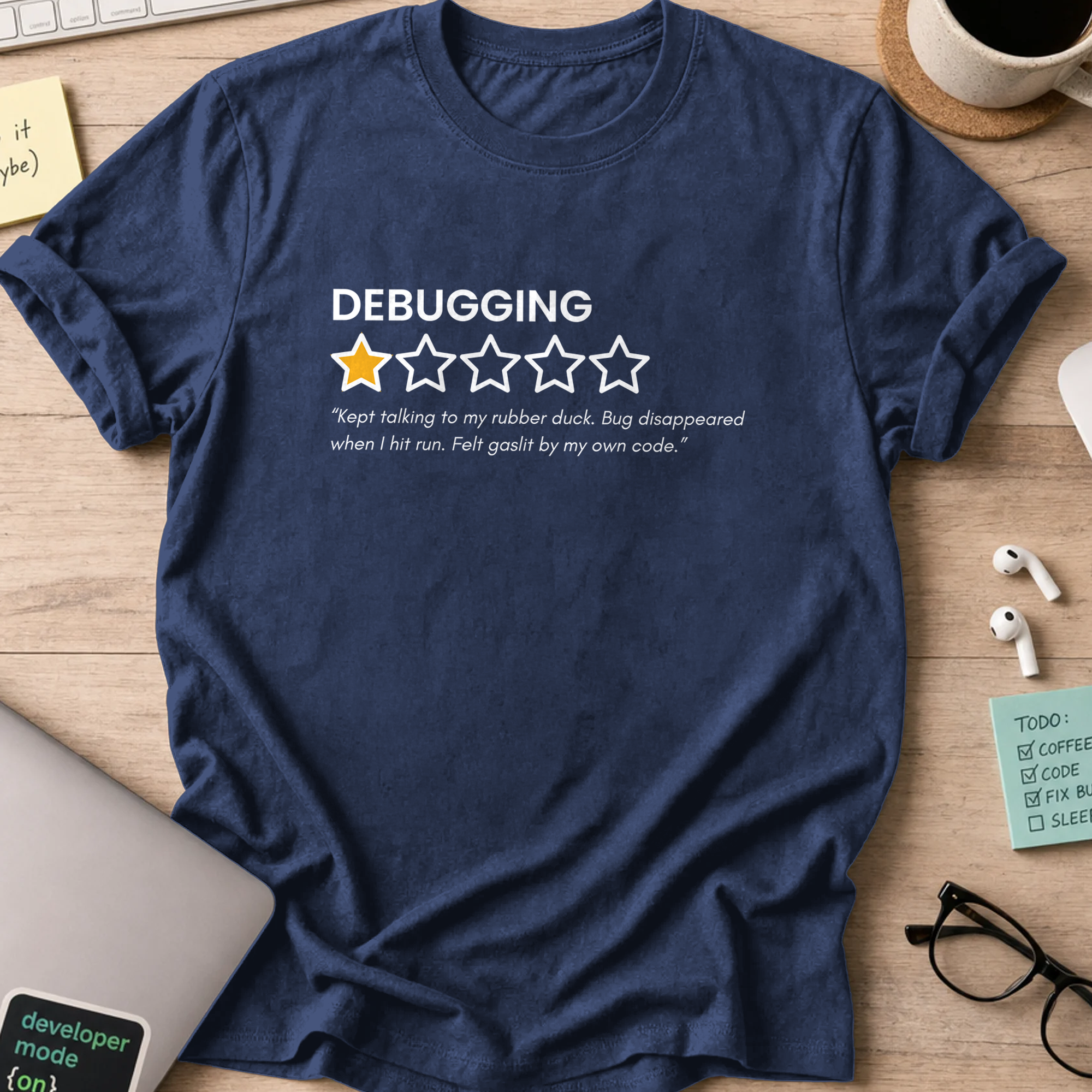 Navy programmer shirt printed with "debugging review", a funny developer t-shirt and coding gift for software engineers and coders.
