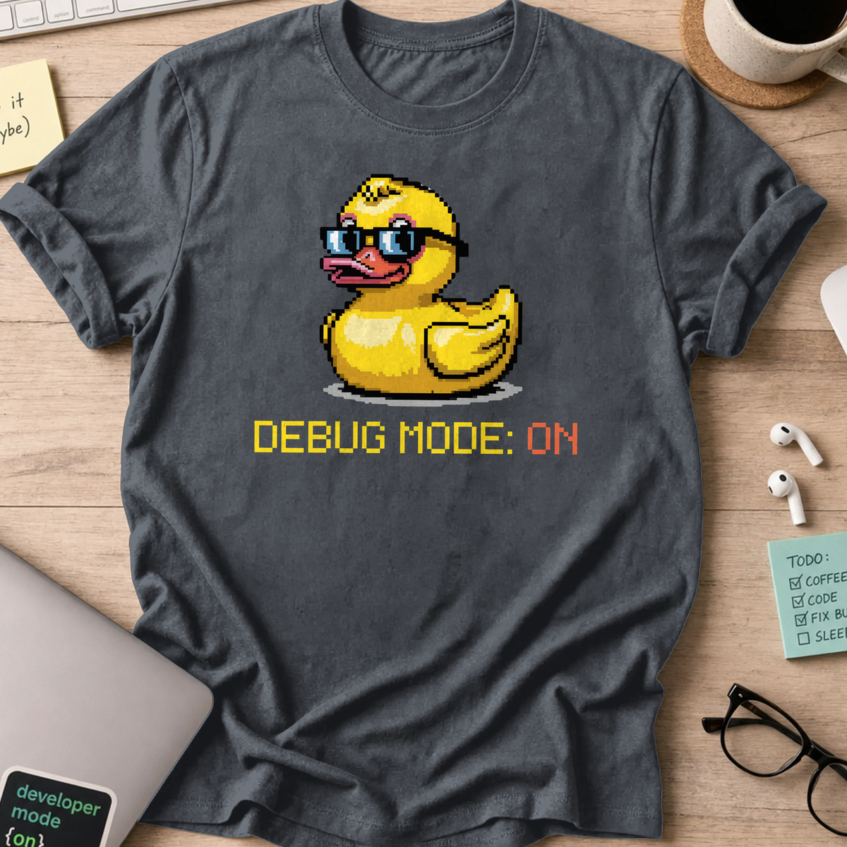 Dark Heather Grey programmer shirt printed with "Debug mode: ON", a funny developer t-shirt and coding gift for software engineers and coders.