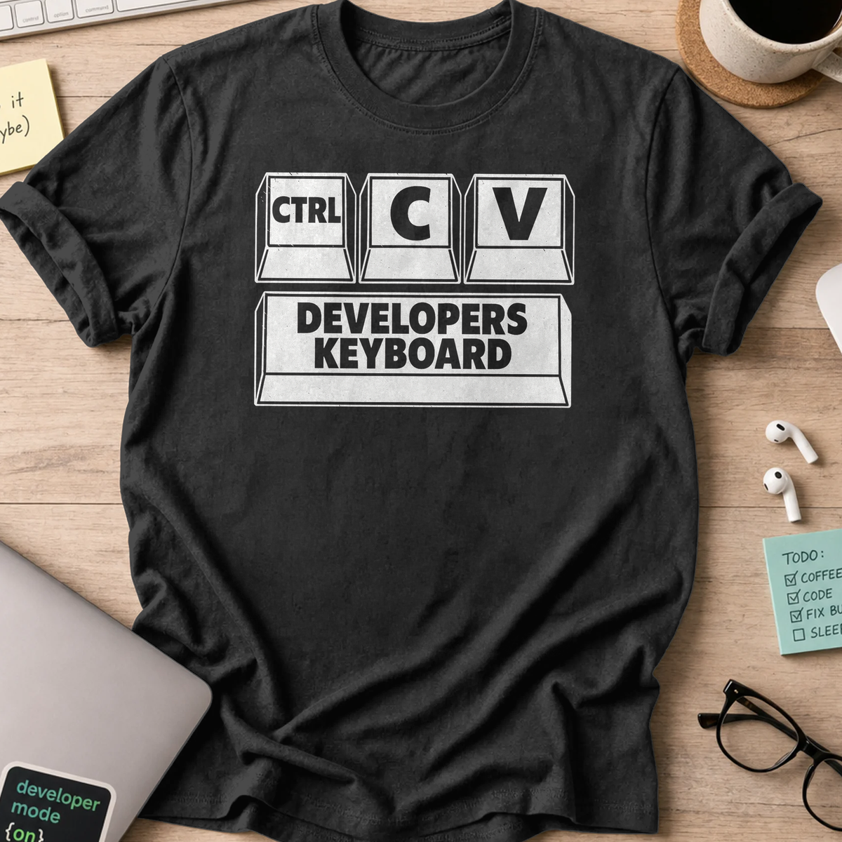 Black programmer shirt printed with "developers keyboard", a funny developer t-shirt and coding gift for software engineers and coders.