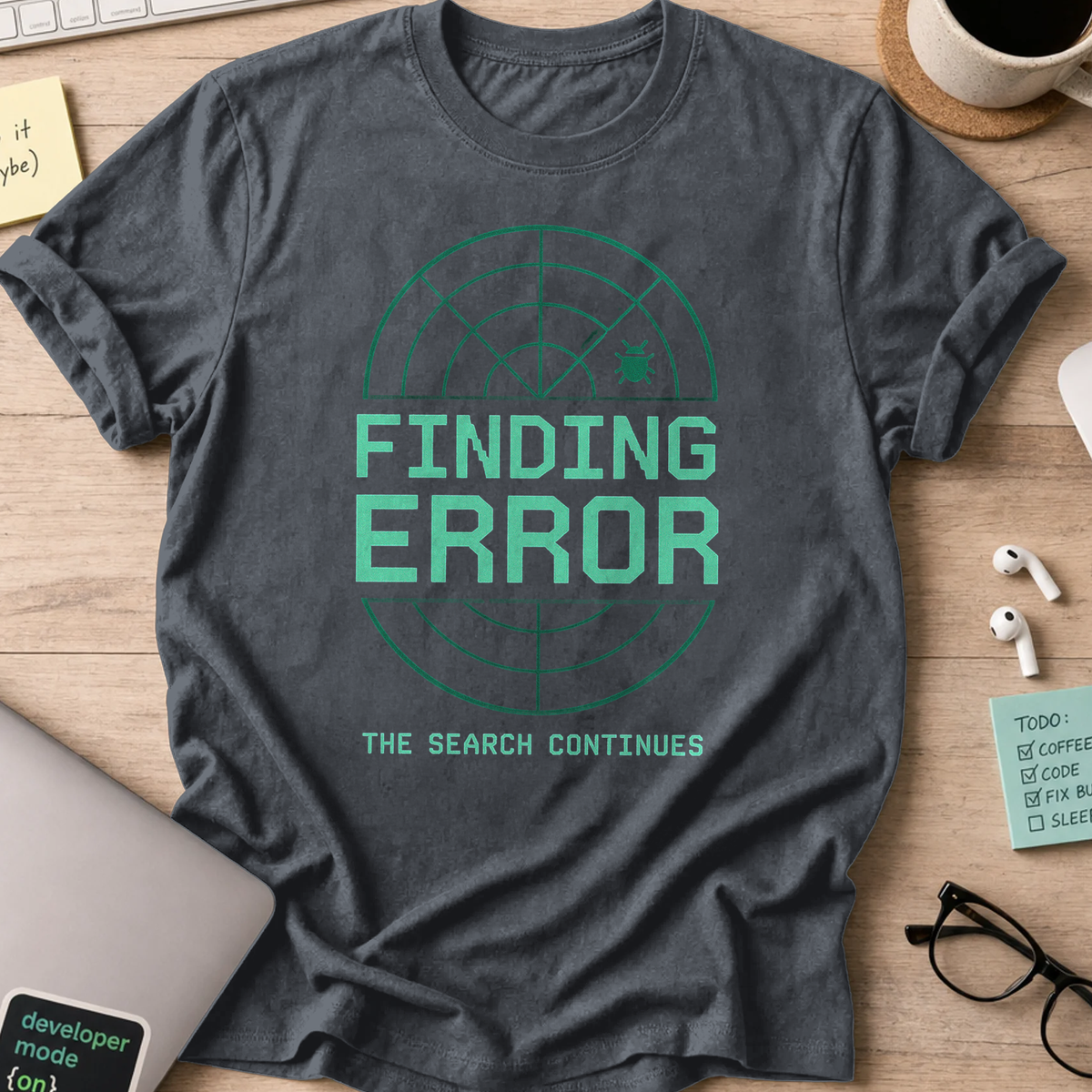 Dark Heather Grey programmer shirt printed with "Finding Error Bug", a funny developer t-shirt and coding gift for software engineers and coders.