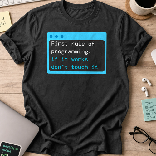 Black programmer shirt printed with "first rule of programming", a funny developer t-shirt and coding gift for software engineers and coders.