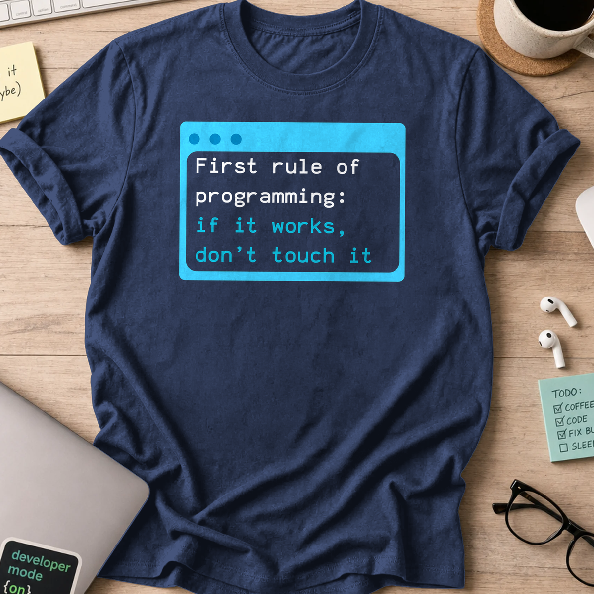 Navy programmer shirt printed with "first rule of programming", a funny developer t-shirt and coding gift for software engineers and coders.