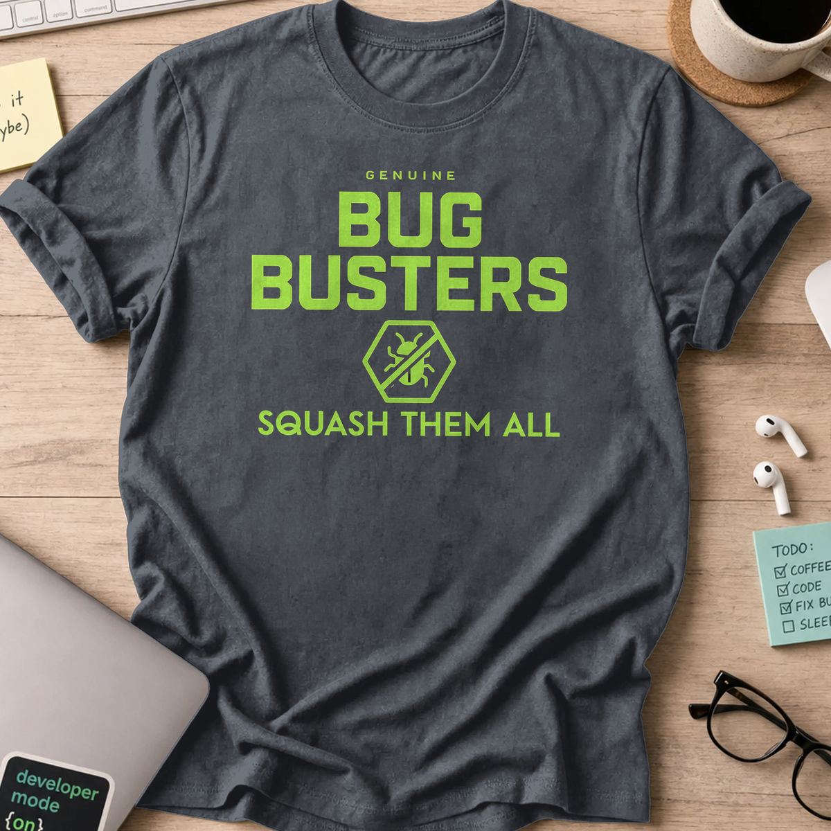Dark Heather Grey programmer shirt printed with "genuine bug buster", a funny developer t-shirt and coding gift for software engineers and coders.