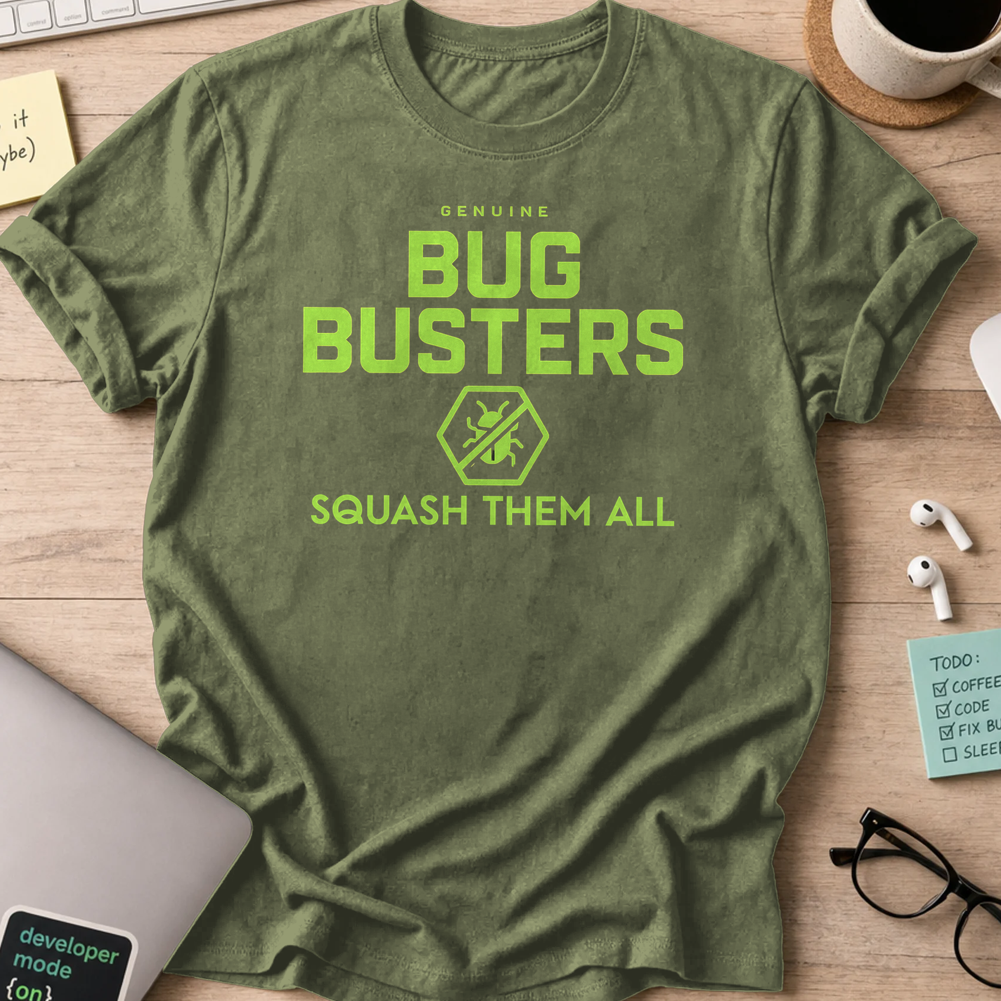 Military Green programmer shirt printed with "genuine bug buster", a funny developer t-shirt and coding gift for software engineers and coders.