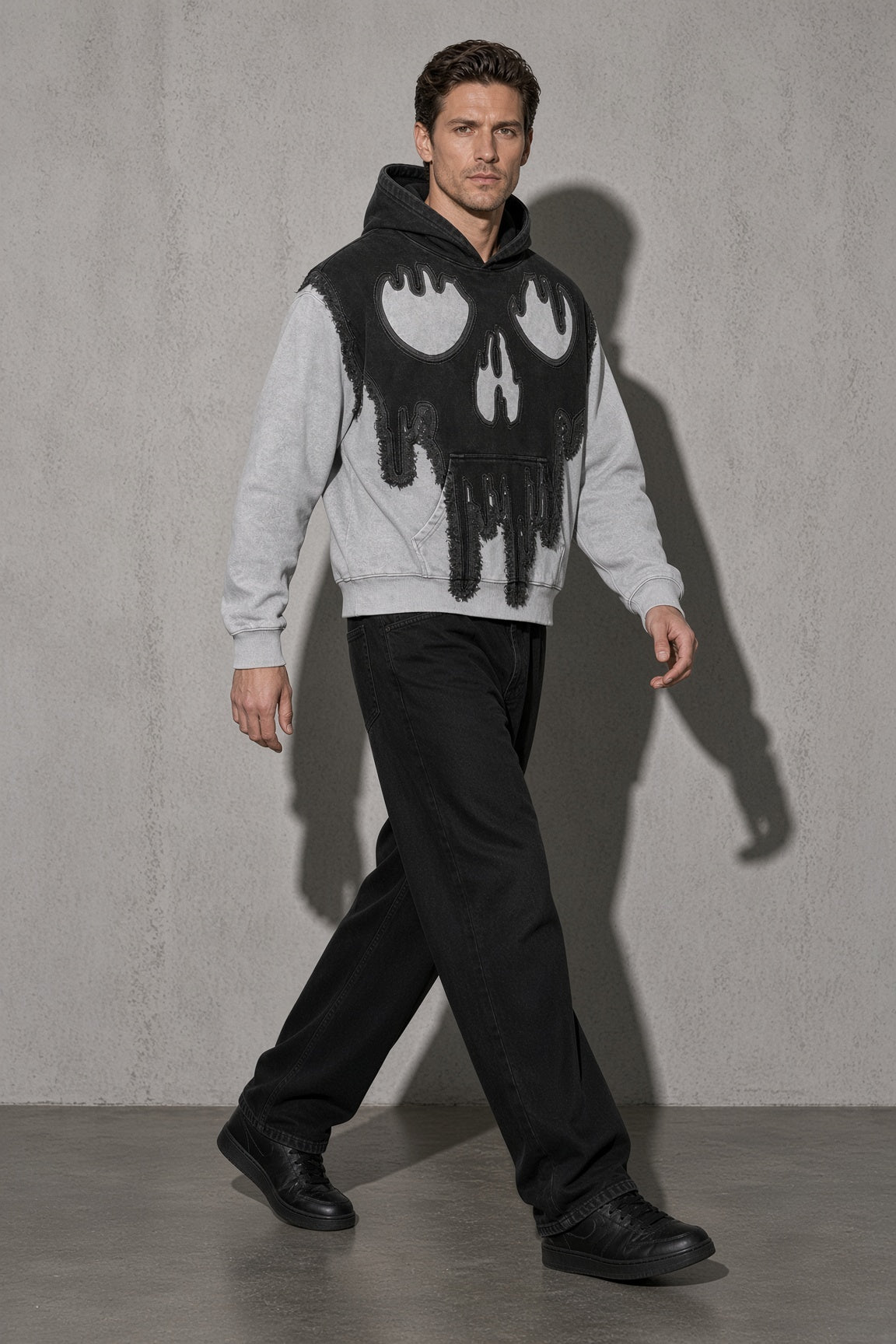 Dripping skull men's black hoodie, full-body view