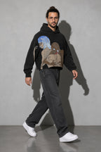 Men's black surrealist figures graphic hoodie full-body view