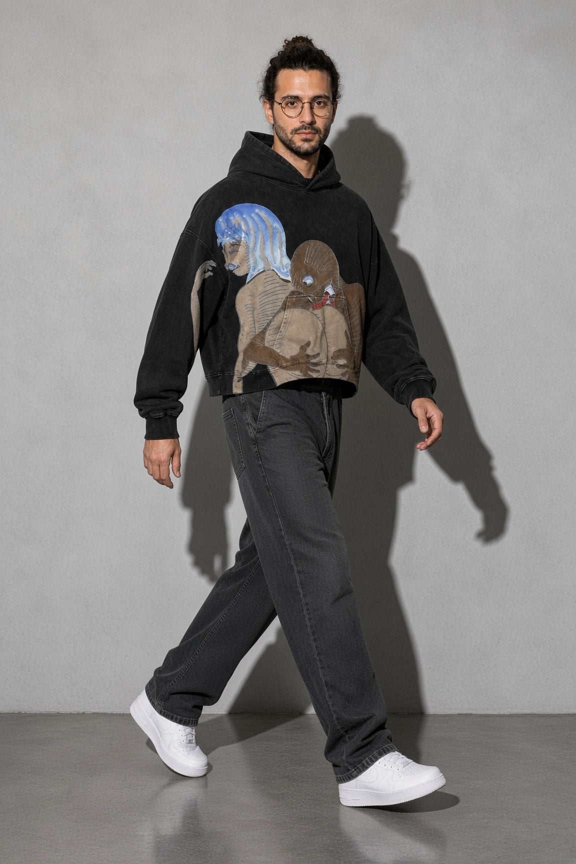 Men's black surrealist figures graphic hoodie full-body view