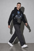 Men's black defiant skeleton graphic hoodie walking view