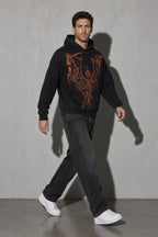 Men's black winged skeleton graphic hoodie walking view