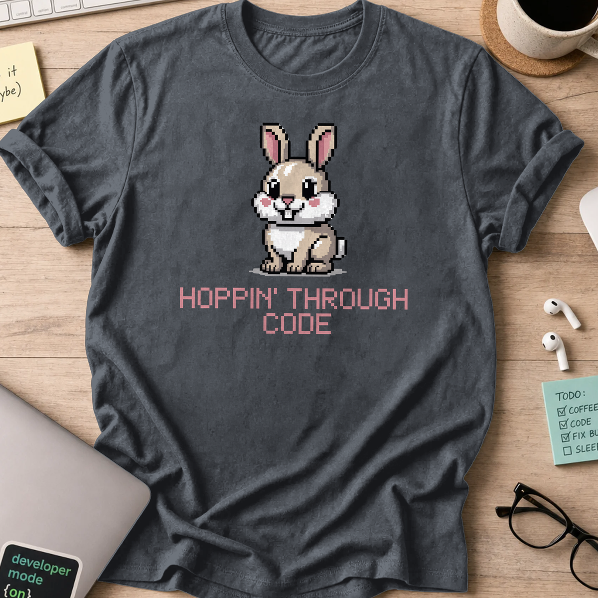 Dark Heather Grey programmer shirt printed with "Hoppin' through code", a funny developer t-shirt and coding gift for software engineers and coders.