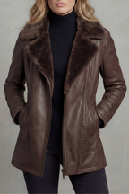 Brown shearling-lined leather jacket with stand collar, zip front, and side pockets