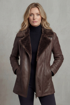 Brown leather jacket with plush shearling collar, zip front, and angled side pockets