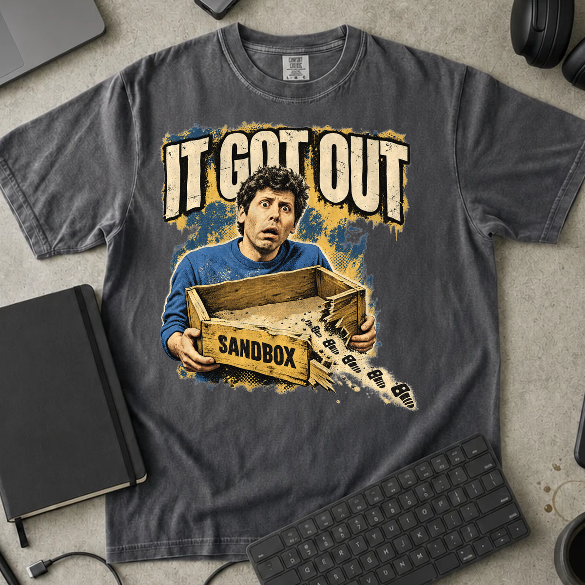 It Got Out Shirt — Pepper Comfort Colors 1717 flat lay