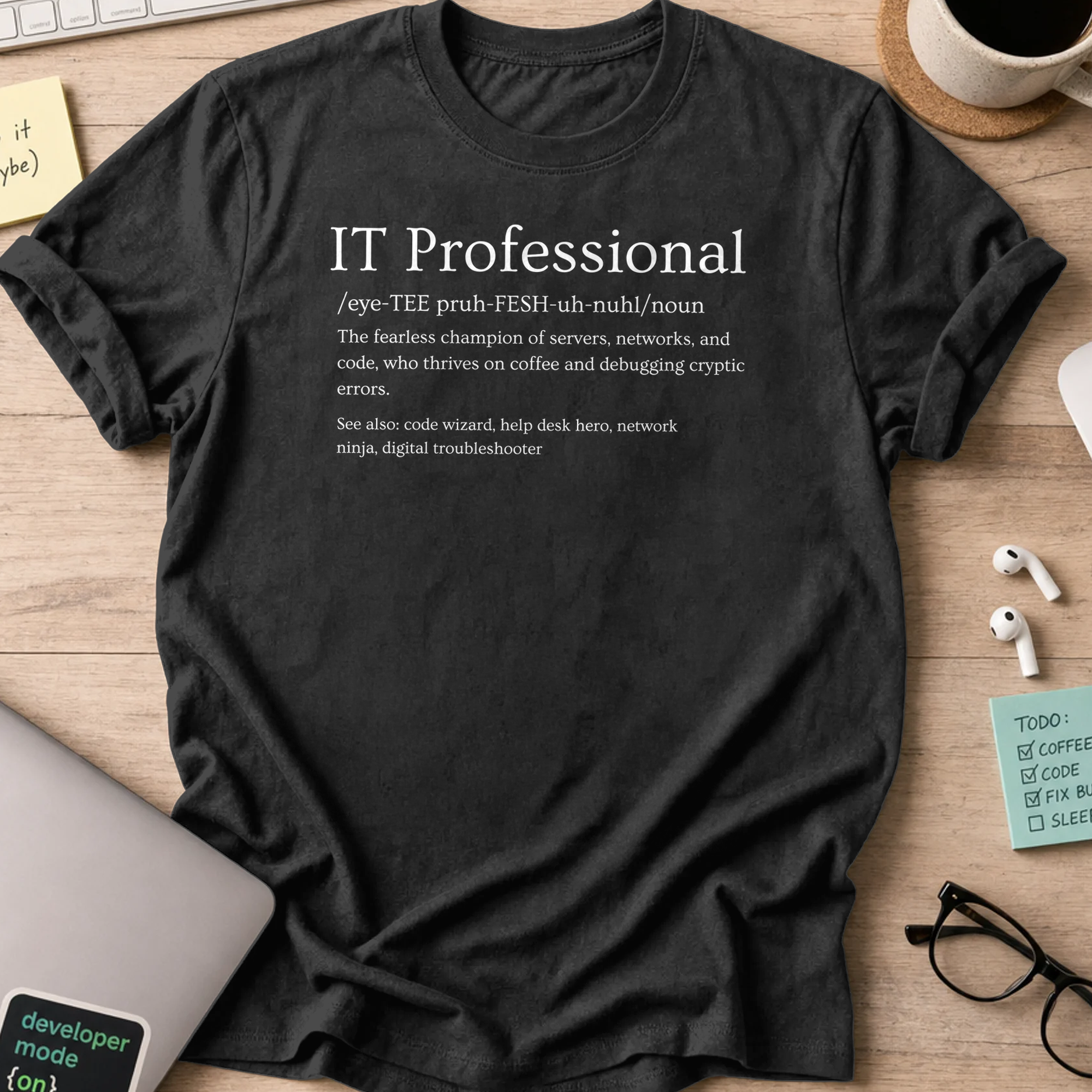 Black devops shirt printed with "IT professional definition", a funny programmer t-shirt and coding gift for software engineers and DevOps teams.