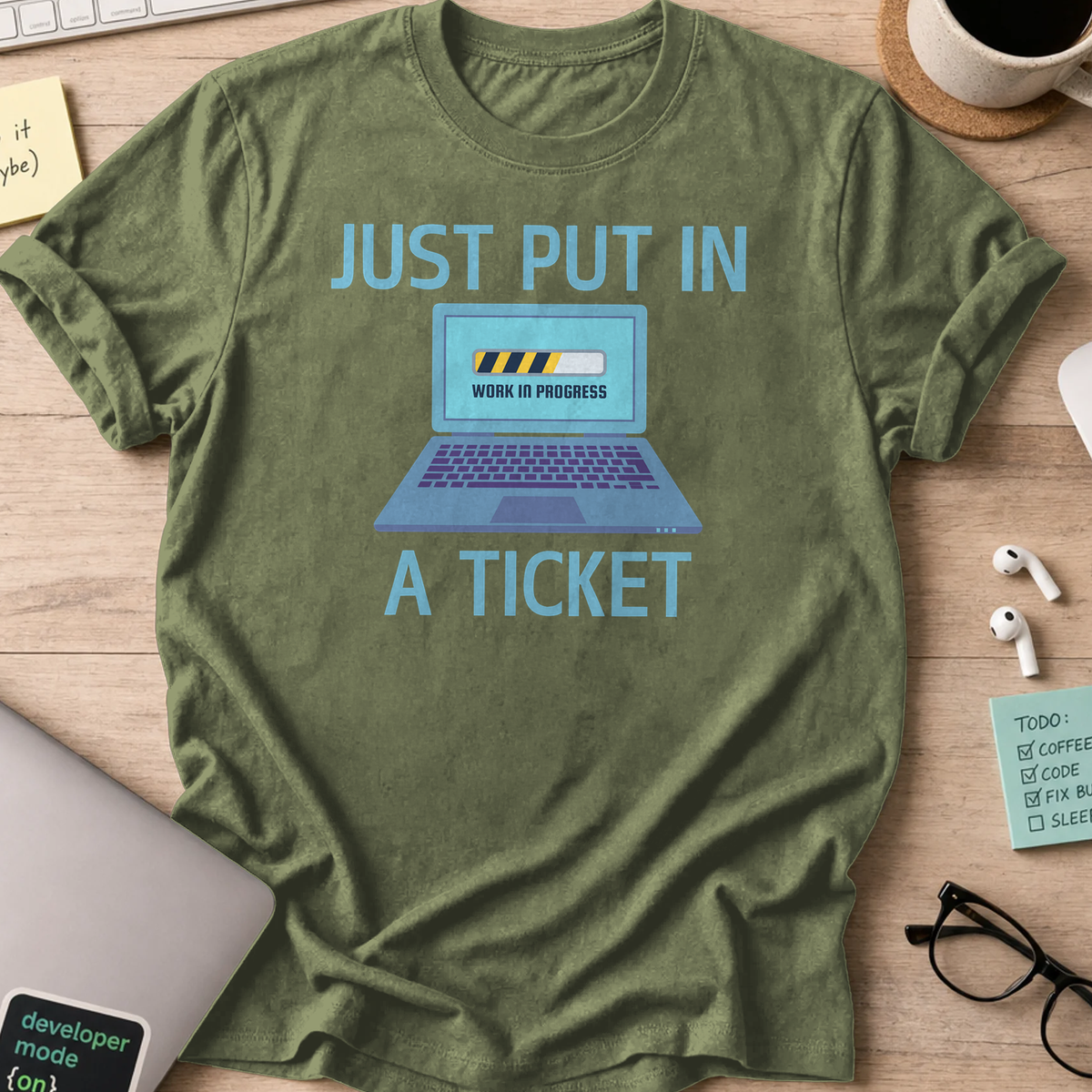 Military Green devops shirt printed with "just put in a ticket", a funny programmer t-shirt and coding gift for software engineers and DevOps teams.