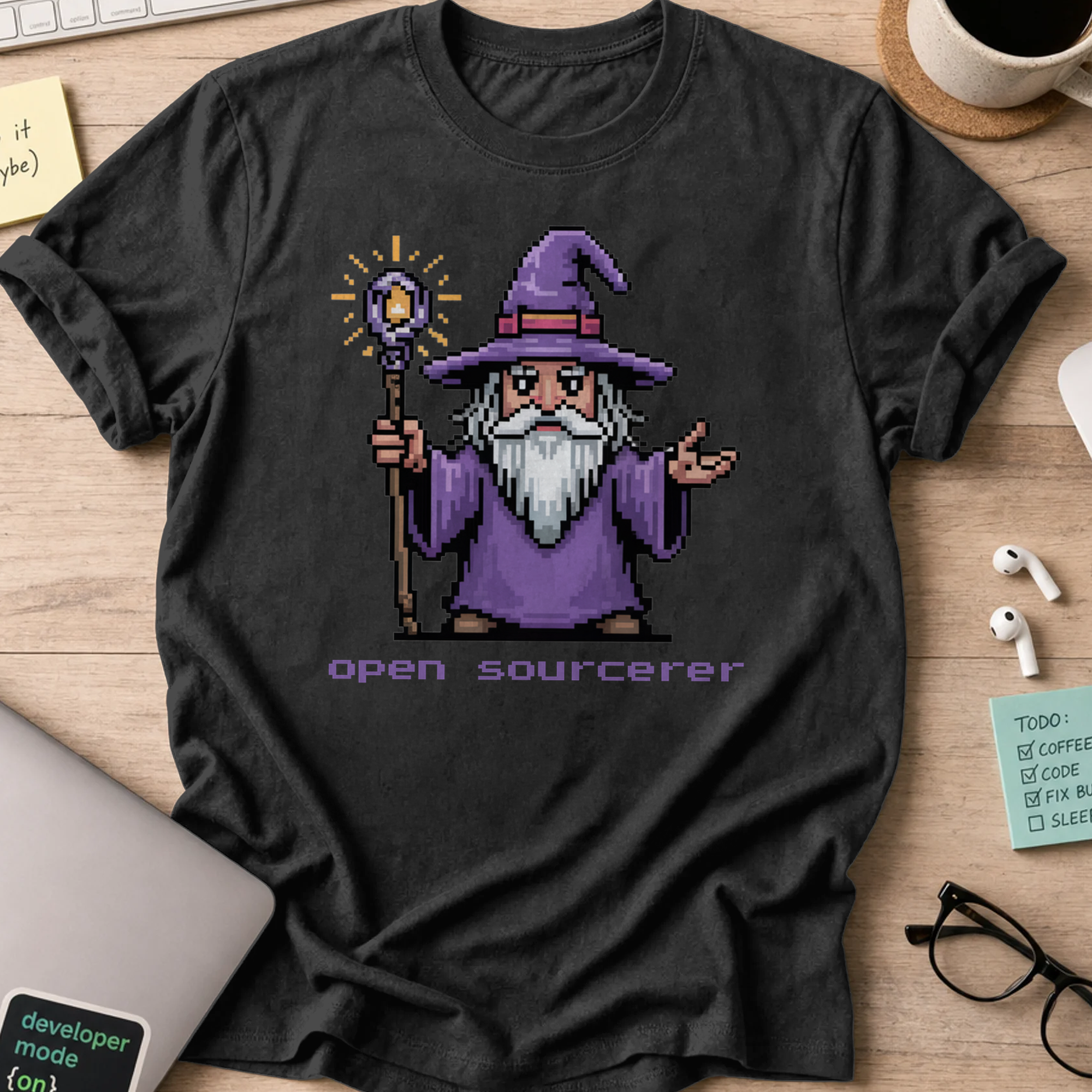 Black programmer shirt printed with "open sourcerer", a funny developer t-shirt and coding gift for software engineers and coders.