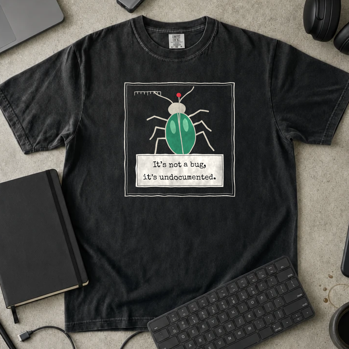 It's Not a Bug It's Undocumented Shirt — Black Comfort Colors 1717 flat lay