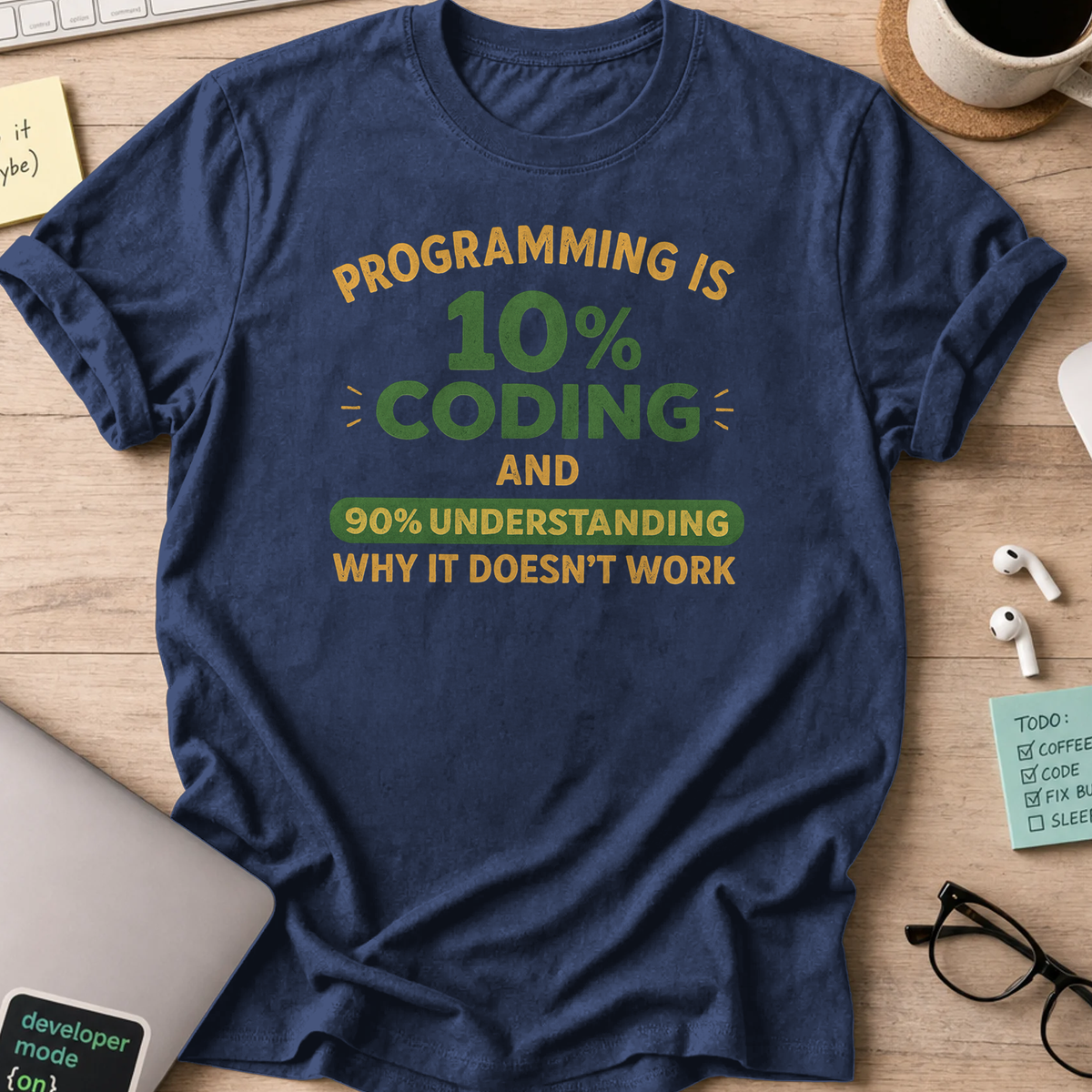Navy programmer shirt printed with "programming is 10% coding", a funny developer t-shirt and coding gift for software engineers and coders.