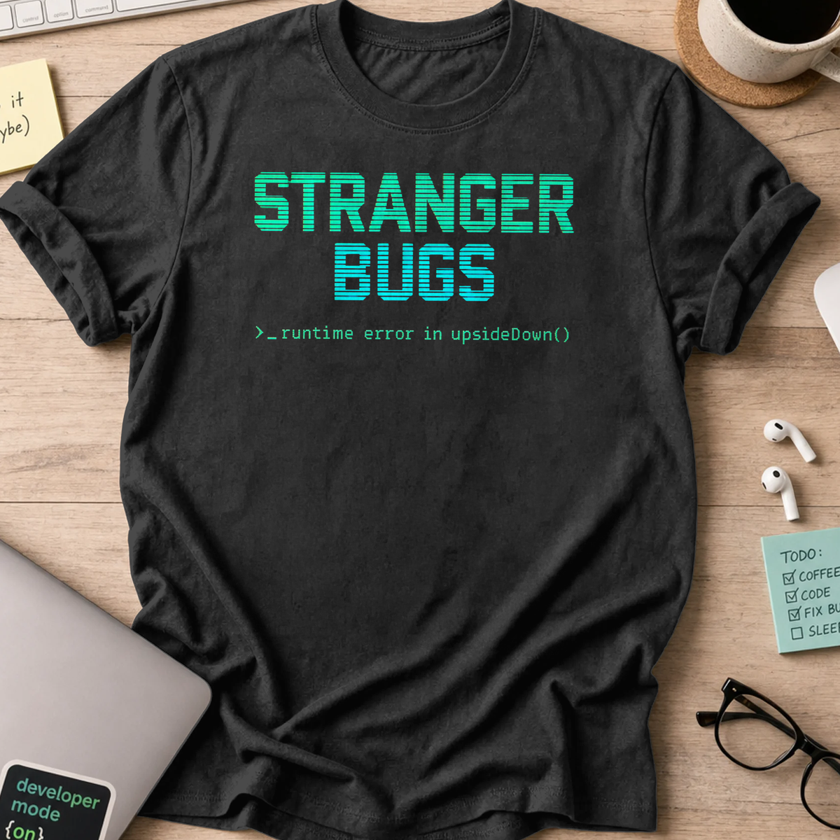 Black programmer shirt printed with "stranger bugs", a funny developer t-shirt and coding gift for software engineers and coders.