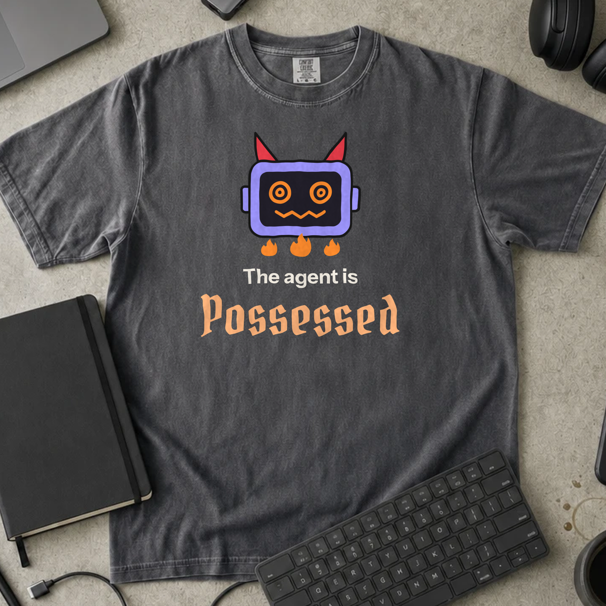 The Agent Is Possessed Shirt — Pepper Comfort Colors 1717 flat lay