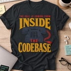 The Call Is Coming from Inside the Codebase Shirt — Black storefront mockup