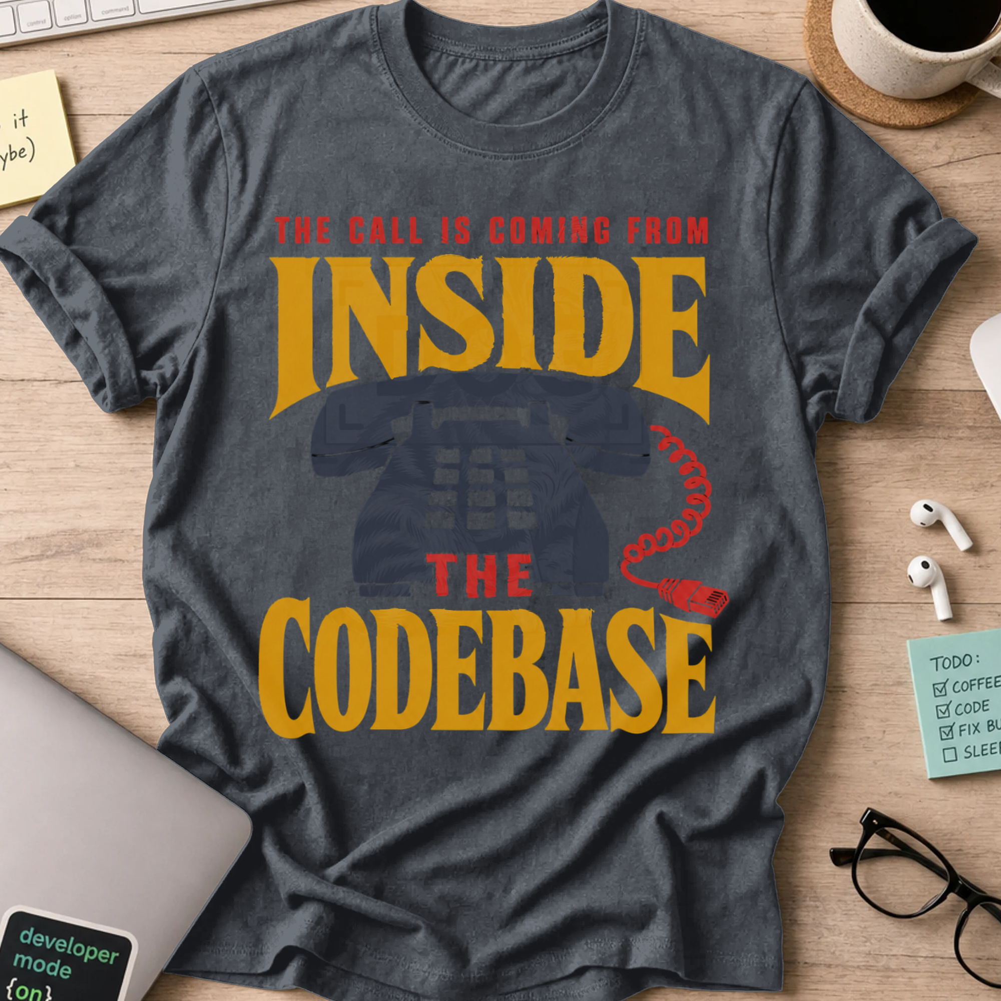 The Call Is Coming from Inside the Codebase Shirt — Dark Heather storefront mockup