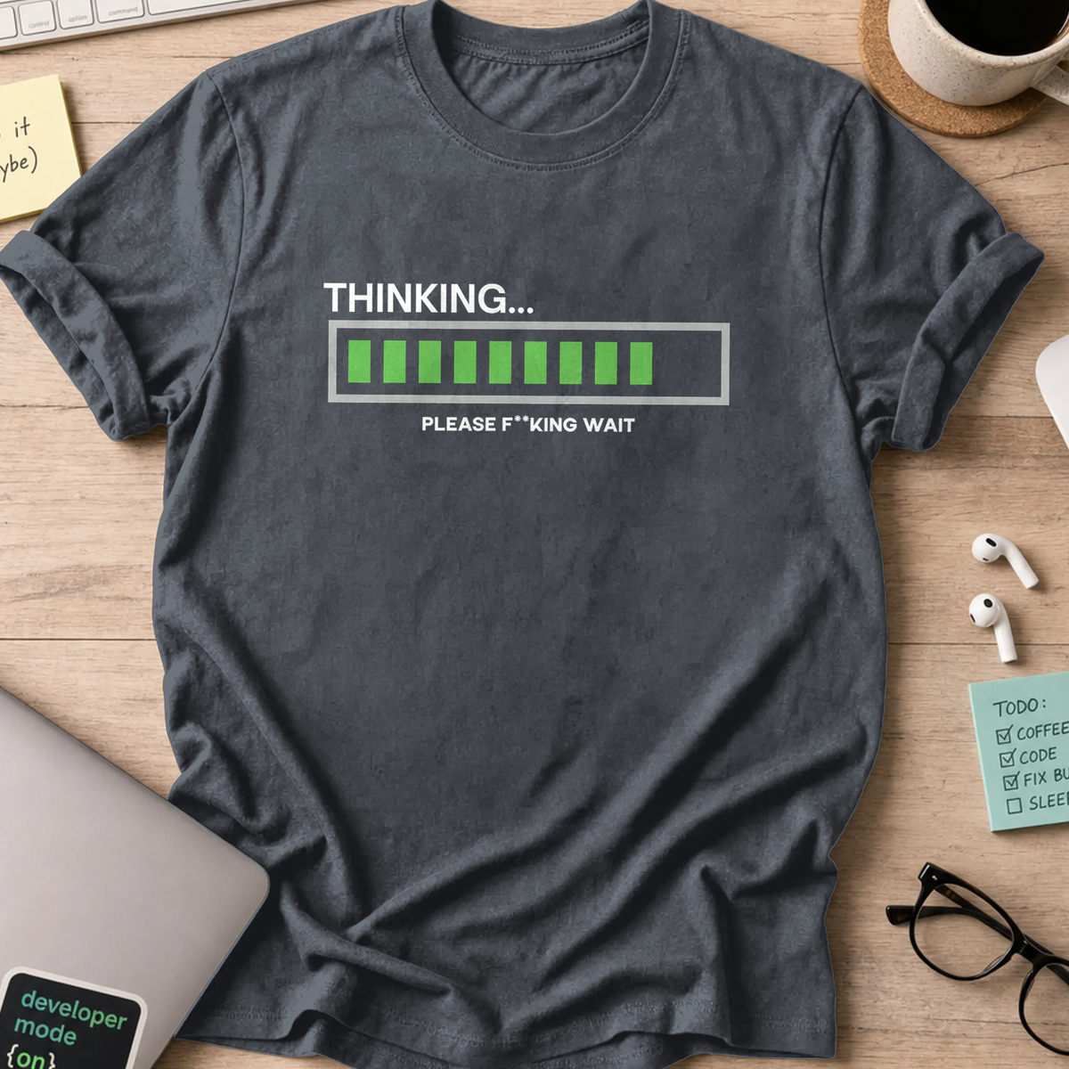 Dark Heather Grey programmer shirt printed with "Thinking... Please wait", a funny developer t-shirt and coding gift for software engineers.