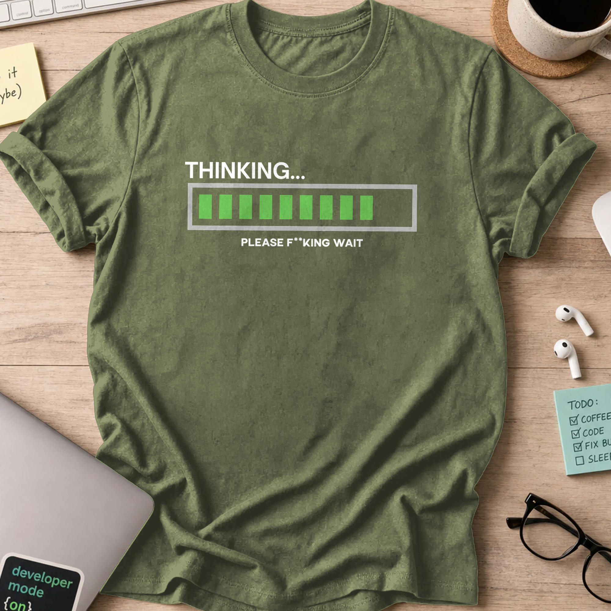 Military Green programmer shirt printed with "Thinking... Please wait", a funny developer t-shirt and coding gift for software engineers and coders.