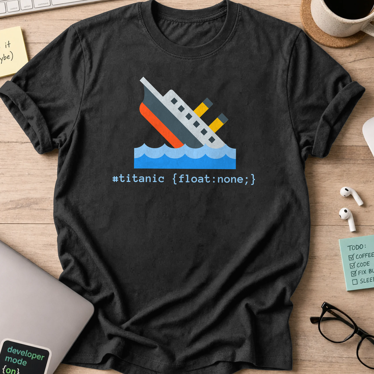 Black developer shirt printed with "#titanic", a funny coding t-shirt and coding gift for frontend developers.