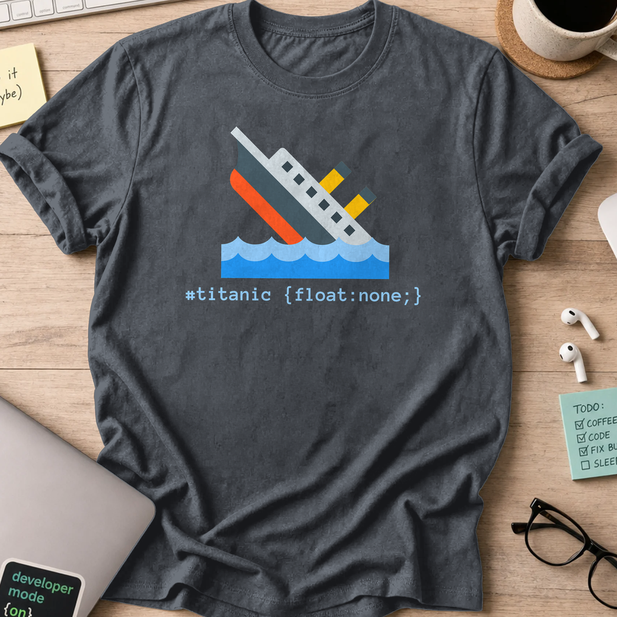 Dark Heather Grey developer shirt printed with "#titanic", a funny coding t-shirt and coding gift for frontend developers.