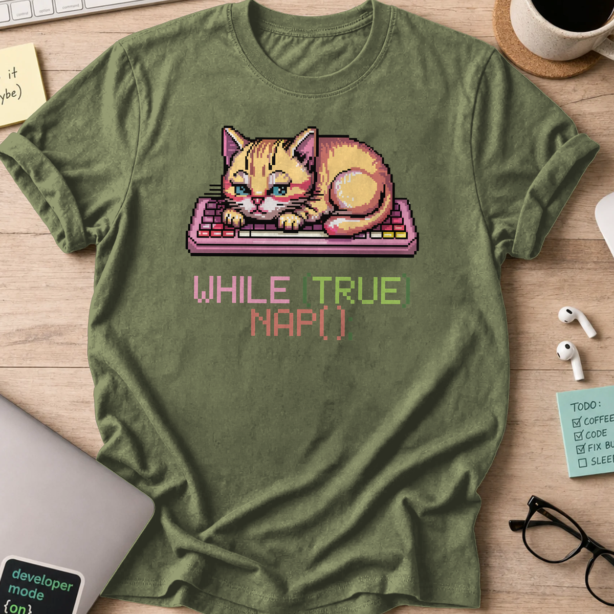 Military Green programmer shirt printed with "while(true) nap()", a funny developer t-shirt and coding gift for software engineers and coders.